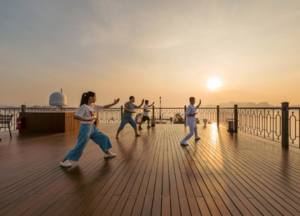 A second Tai Chi session takes place on the sundeck