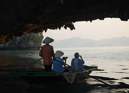 explore Bright Cave on a bamboo boat